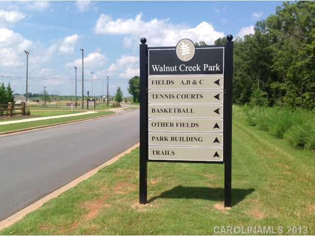 78047 Rillstone Drive, Unit 236 Lancaster, SC 29720 - Photo 16 of 16 a view of a park with a sign board
