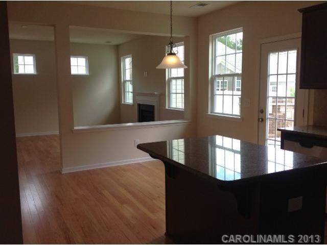 78047 Rillstone Drive, Unit 236 Lancaster, SC 29720 - Photo 7 of 16 a view of entryway and hall with wooden floor