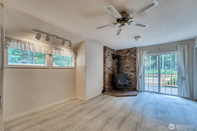 a bedroom with a large bed couch and a window