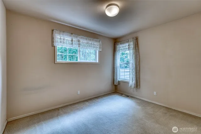 a bathroom with a sink double vanity and a mirror
