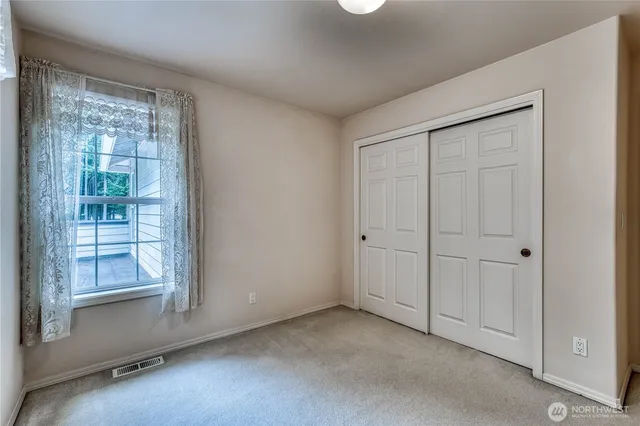 a view of balcony with wooden floor and fence