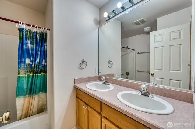 a view of basketball place with large trees