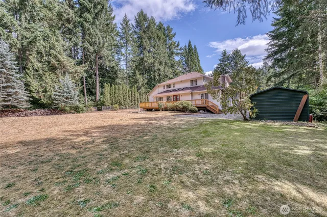 a view of a backyard of the house