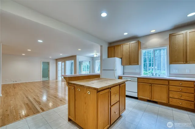 a kitchen with sink and cabinets