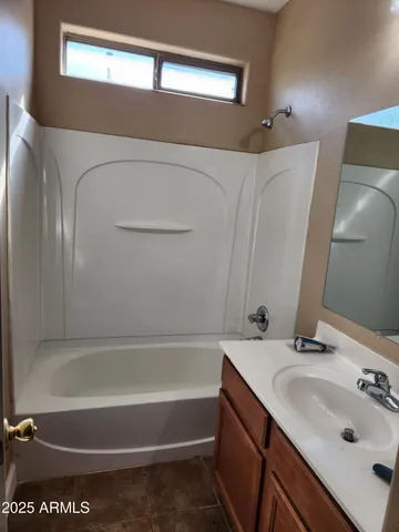 a bathroom with a sink and a bathtub