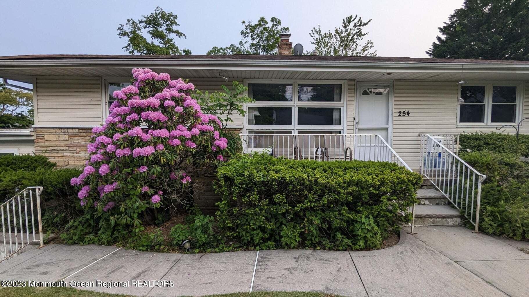 254 Garfield Avenue Oakhurst, NJ 07755 - Photo 2 of 26 a front view of a house