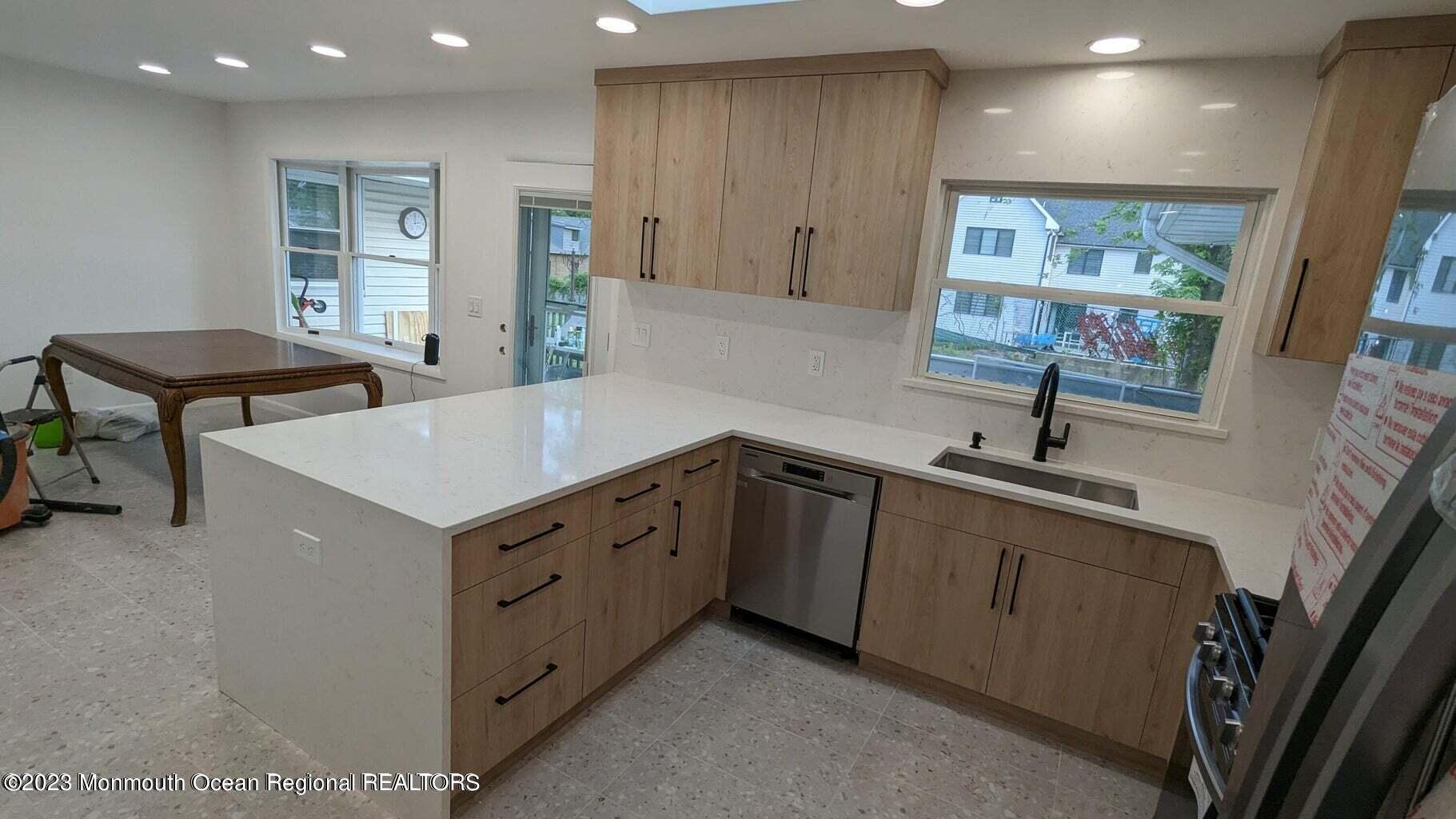 254 Garfield Avenue Oakhurst, NJ 07755 - Photo 5 of 26 a kitchen with sink cabinets and window