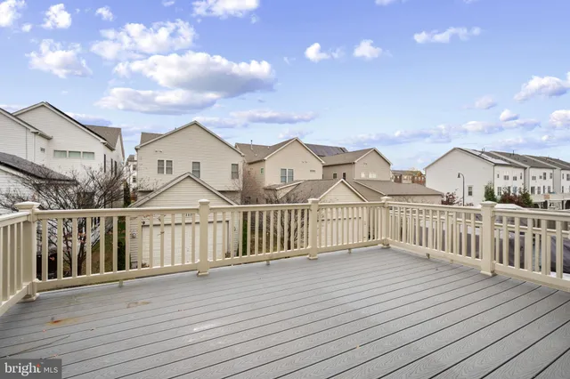 a view of a house with wooden deck