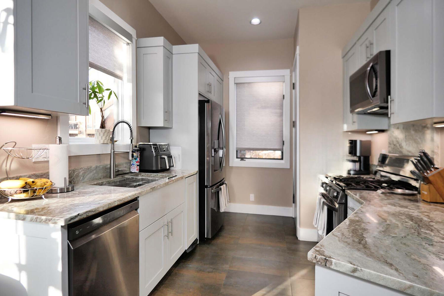 404 Adams Ranch Road, Unit 1201 Mountain Village, CO 81435 - Photo 12 of 47 a kitchen with a sink stove and refrigerator