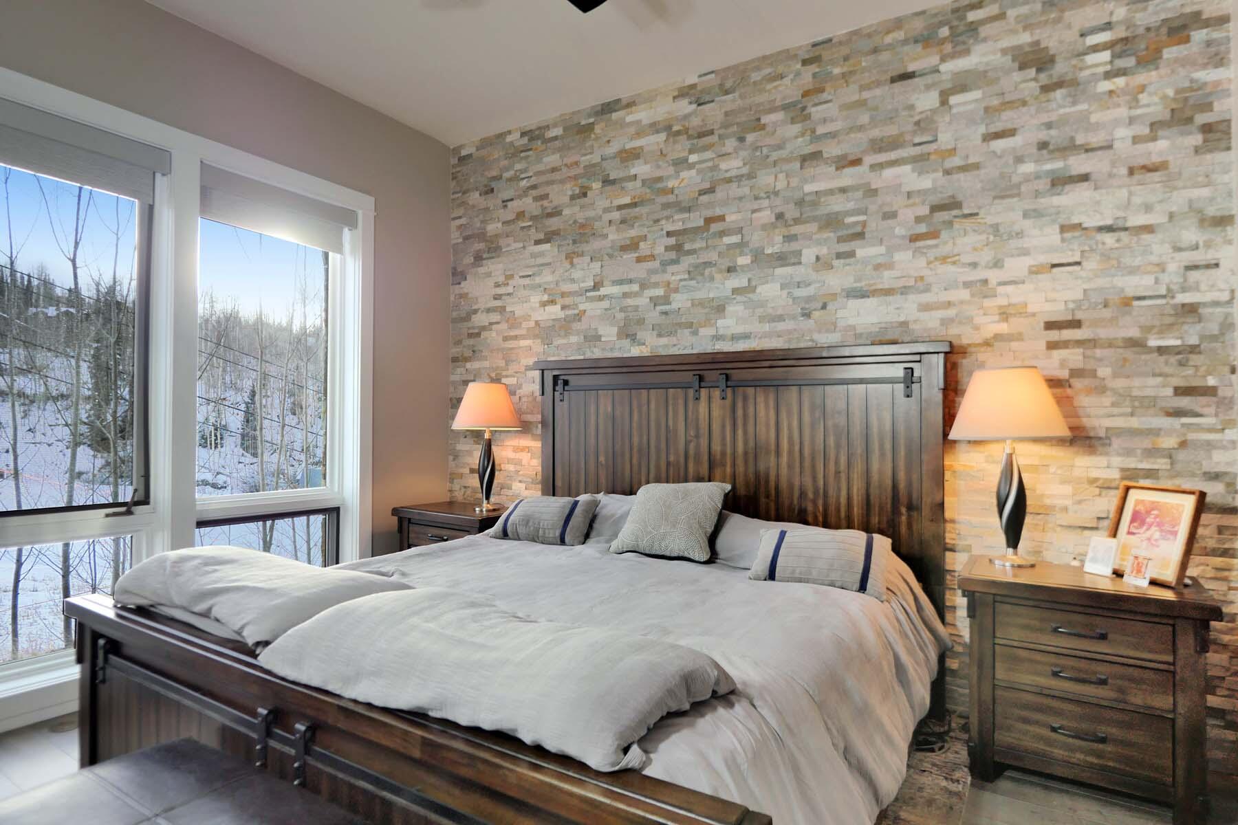 404 Adams Ranch Road, Unit 1201 Mountain Village, CO 81435 - Photo 13 of 47 a bedroom with a bed and a night stand