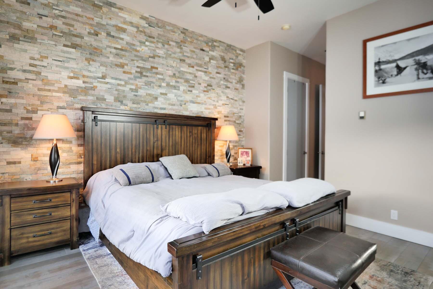 404 Adams Ranch Road, Unit 1201 Mountain Village, CO 81435 - Photo 14 of 47 a bedroom with a bed and a dresser