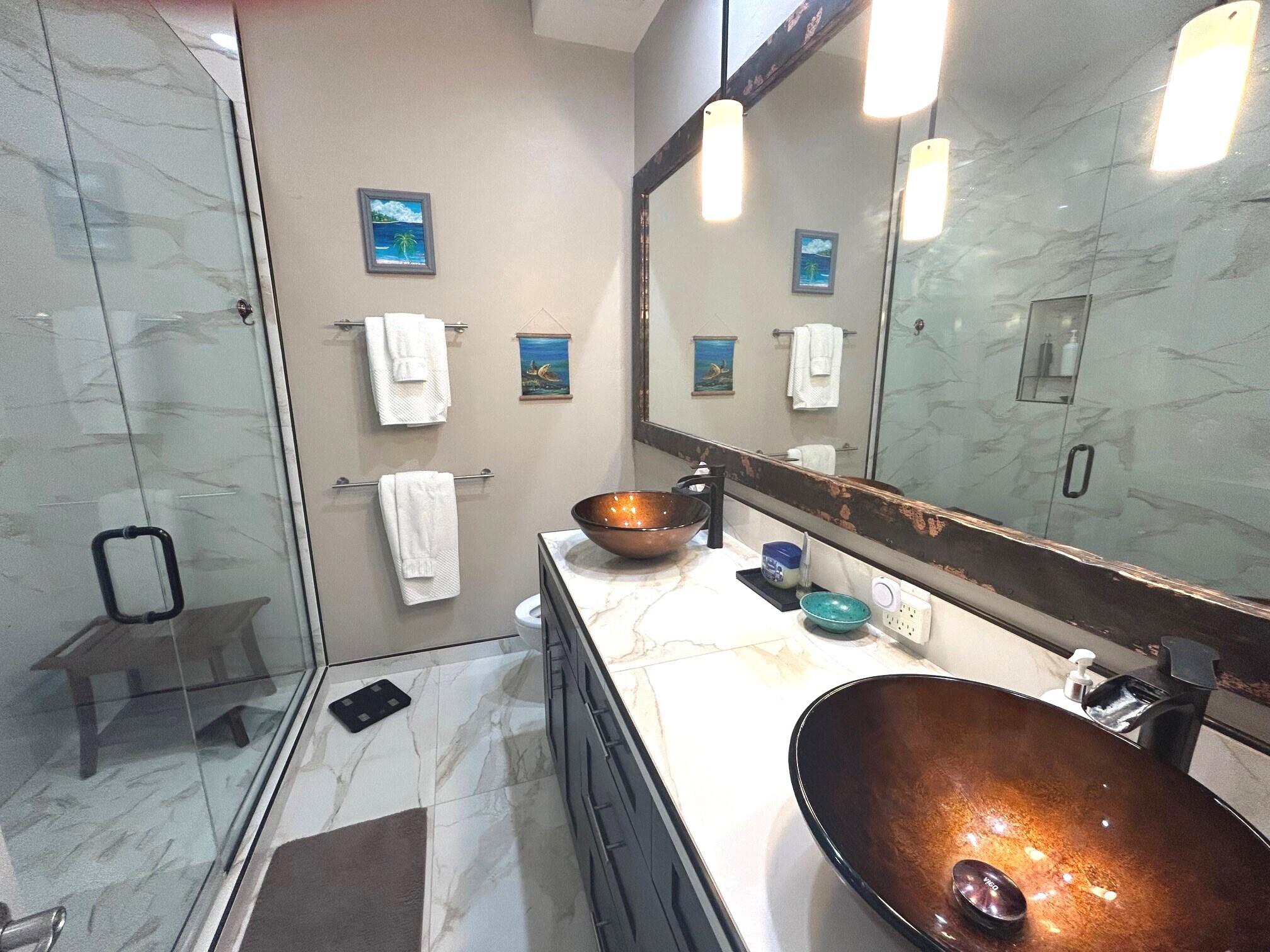 404 Adams Ranch Road, Unit 1201 Mountain Village, CO 81435 - Photo 15 of 47 a bathroom with a granite countertop sink and a mirror
