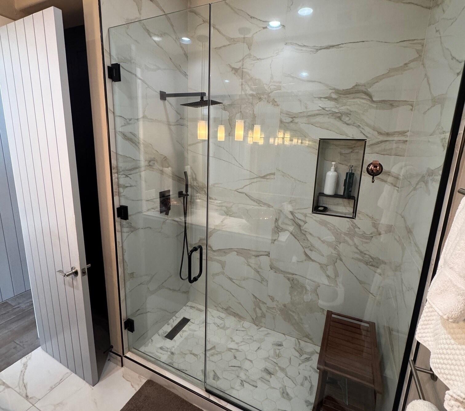 404 Adams Ranch Road, Unit 1201 Mountain Village, CO 81435 - Photo 17 of 47 a bathroom with a glass shower door