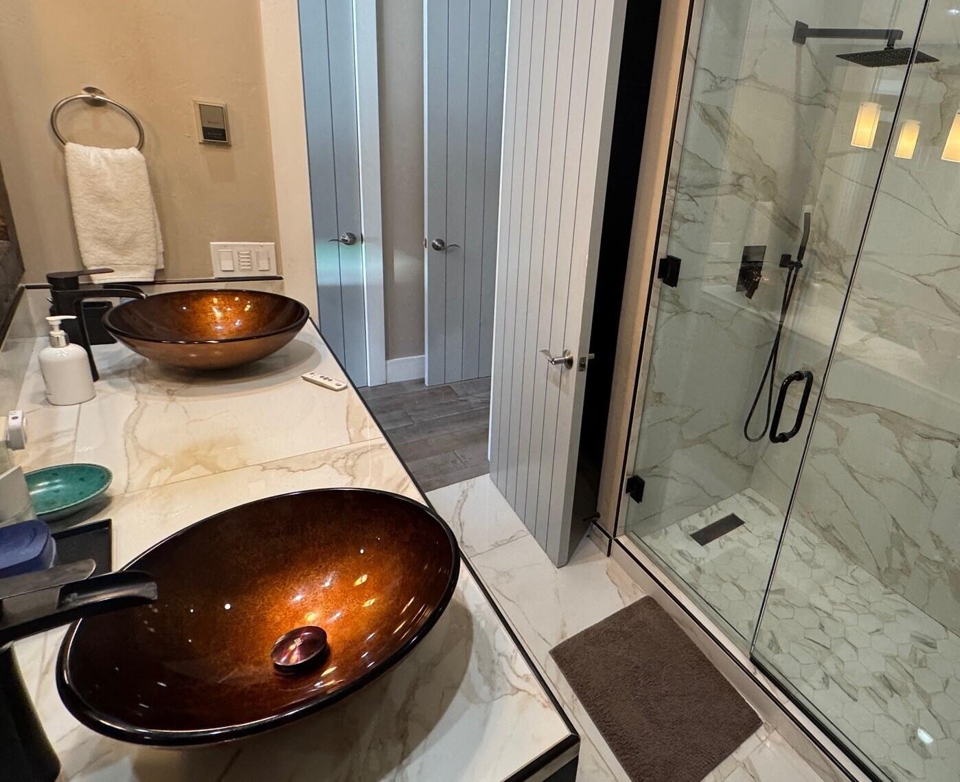 404 Adams Ranch Road, Unit 1201 Mountain Village, CO 81435 - Photo 18 of 47 a bathroom with a sink and mirror