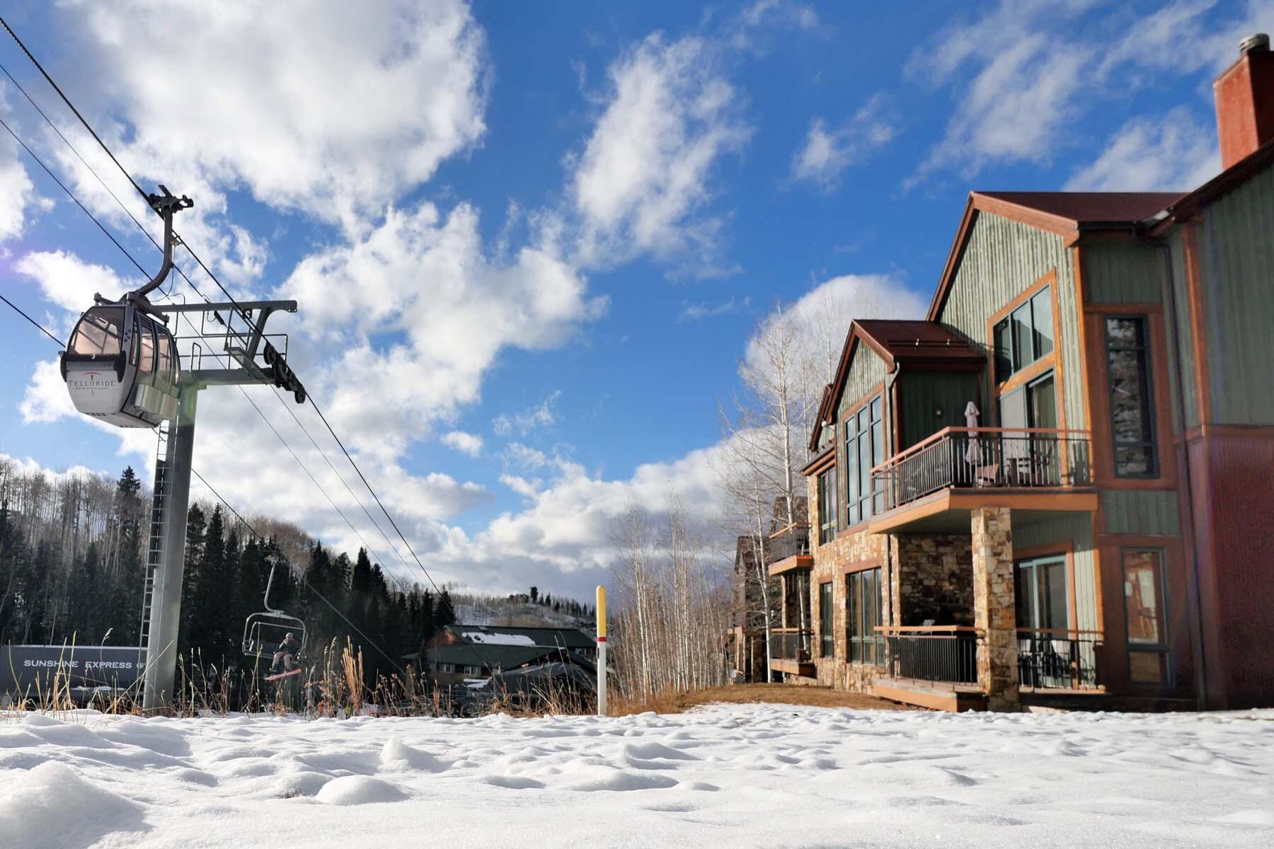 404 Adams Ranch Road, Unit 1201 Mountain Village, CO 81435 - Photo 2 of 47 a front view of a building