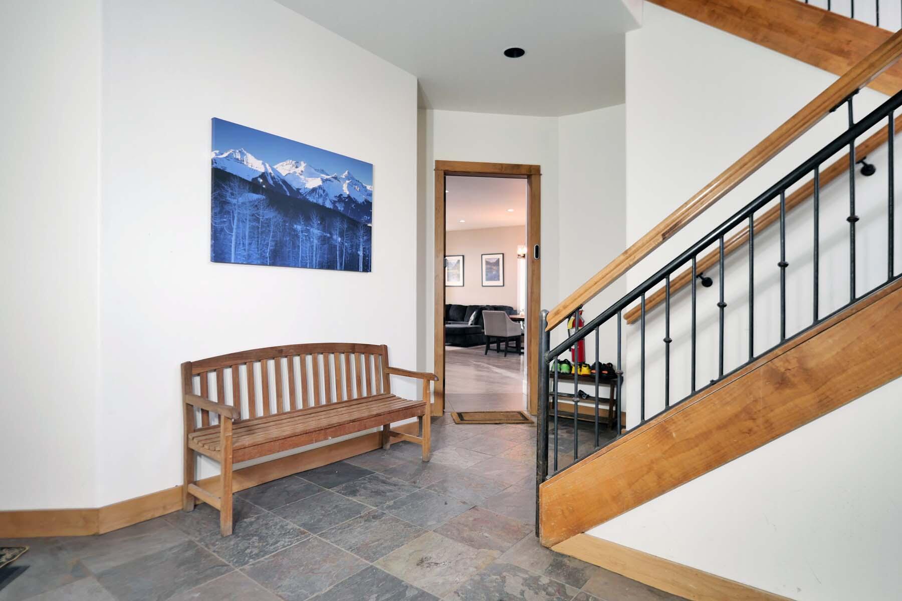 404 Adams Ranch Road, Unit 1201 Mountain Village, CO 81435 - Photo 4 of 47 a view of staircase with lots of furniture