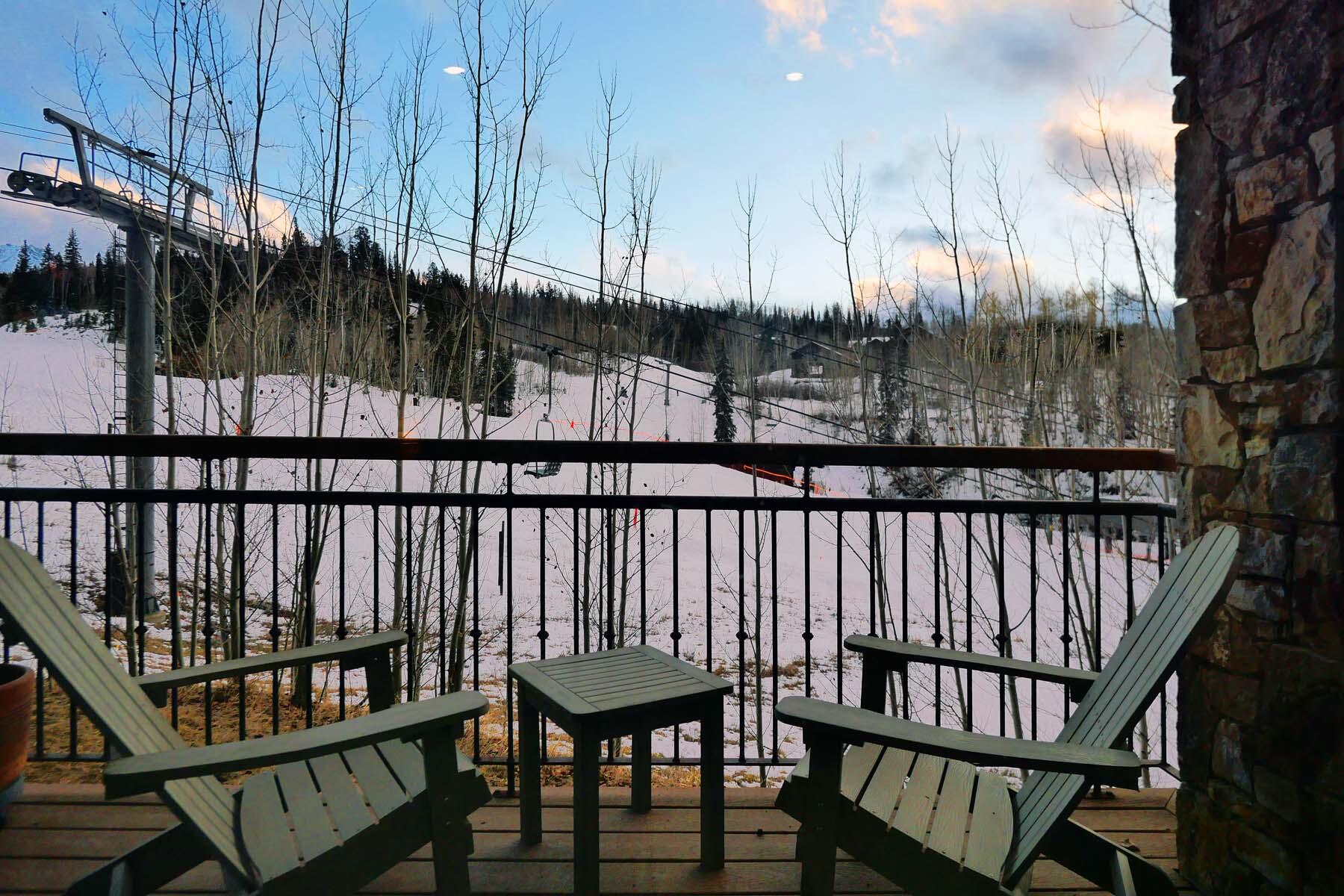 404 Adams Ranch Road, Unit 1201 Mountain Village, CO 81435 - Photo 8 of 47 a view of a chairs and table in patio