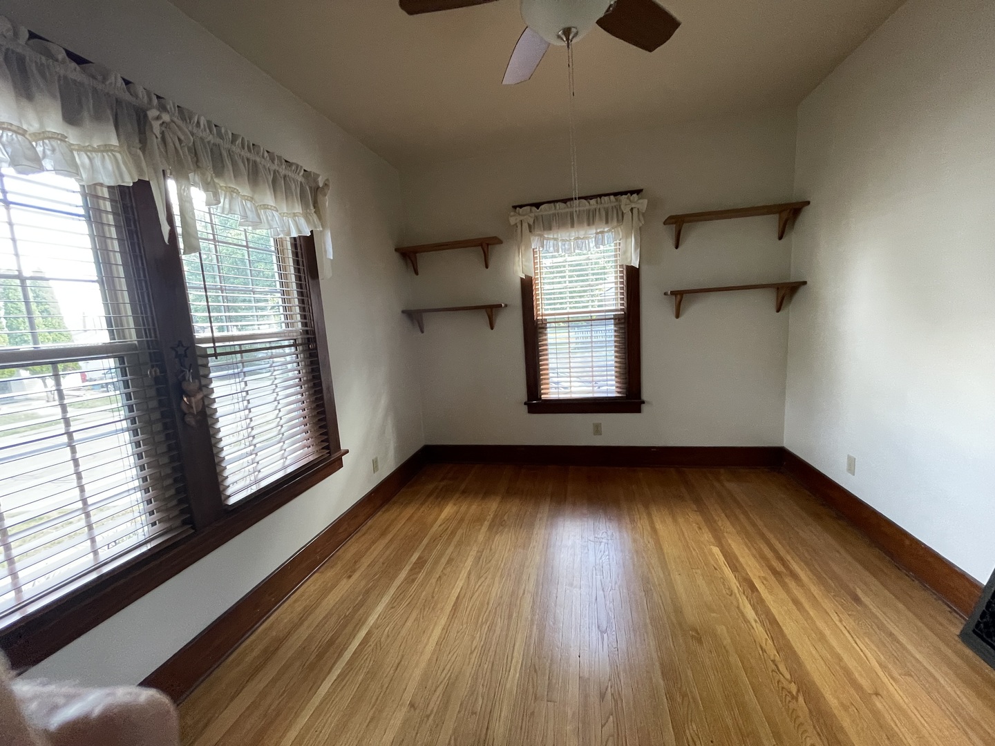 229 West Moore Street Ottawa, IL 61350 - Photo 11 of 33 a view of an empty room with wooden floor and a window