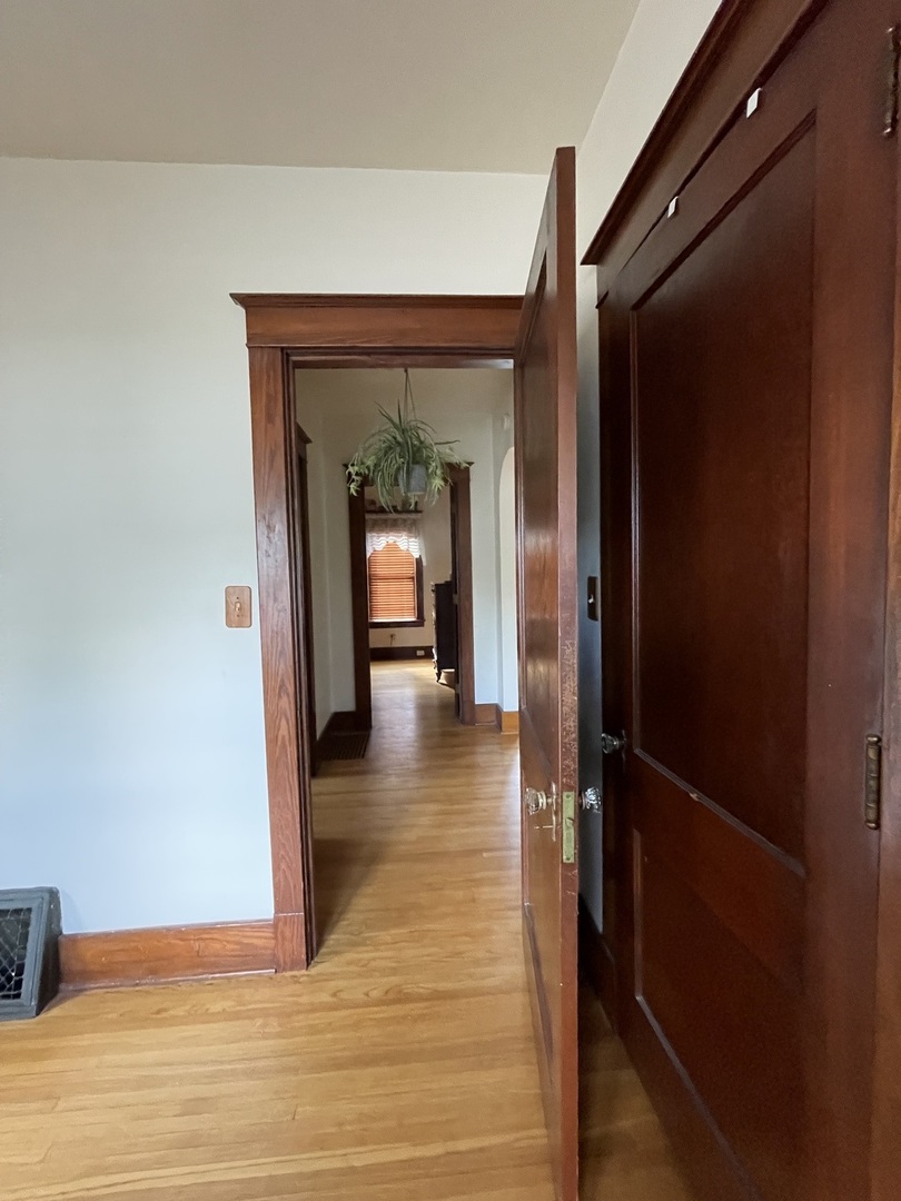 229 West Moore Street Ottawa, IL 61350 - Photo 12 of 33 a view of a hallway view with wooden floor and staircase