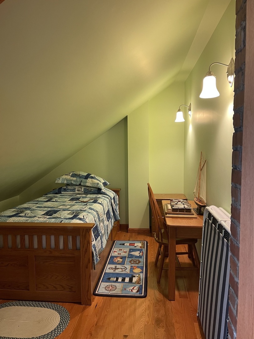 229 West Moore Street Ottawa, IL 61350 - Photo 30 of 33 a bedroom with a bed and a table in it