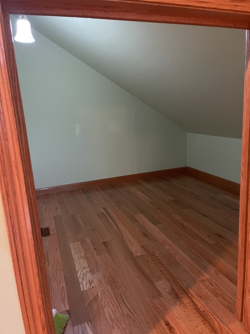229 West Moore Street Ottawa, IL 61350 - Photo 31 of 33 a view of a room with wooden floor and bench
