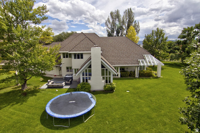 180 Farm Road Midway, UT 84049 - Photo 10 of 99 Expansive lawn with mature trees and a structured patio area