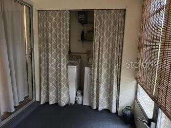 a view of front door with wooden floor