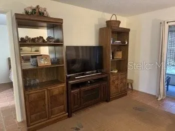 a kitchen with a refrigerator and a stove