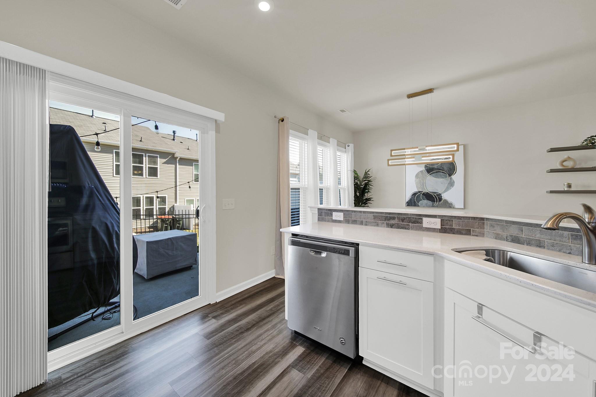 818 Canoe Song Road Fort Mill, SC 29708 - Photo 11 of 36 a kitchen with a sink and refrigerator
