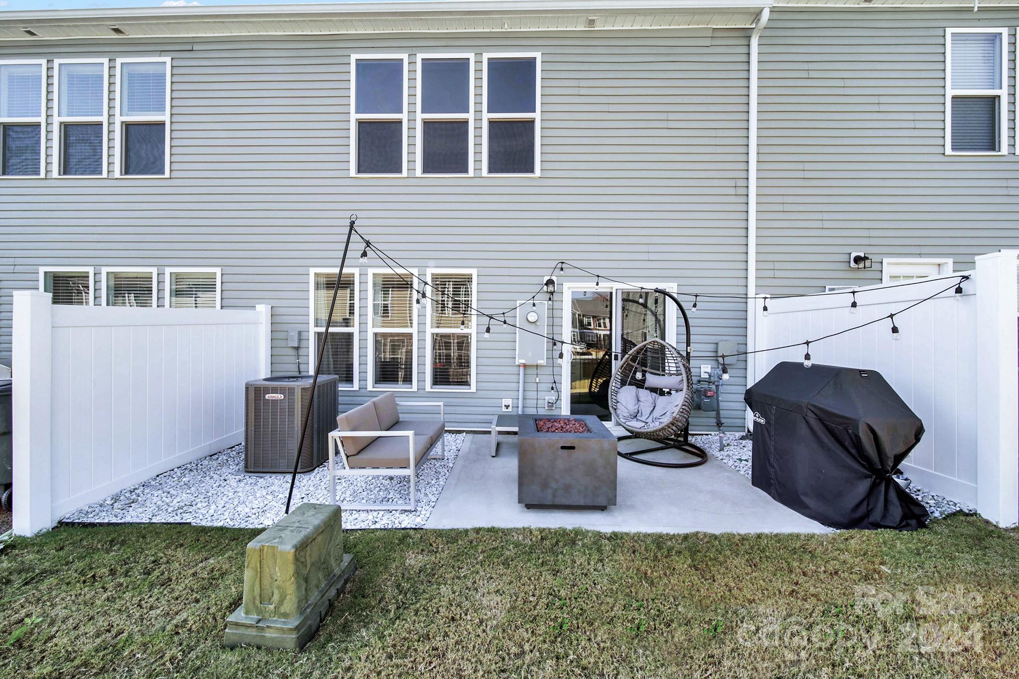 818 Canoe Song Road Fort Mill, SC 29708 - Photo 28 of 36 a backyard of a house with seating space