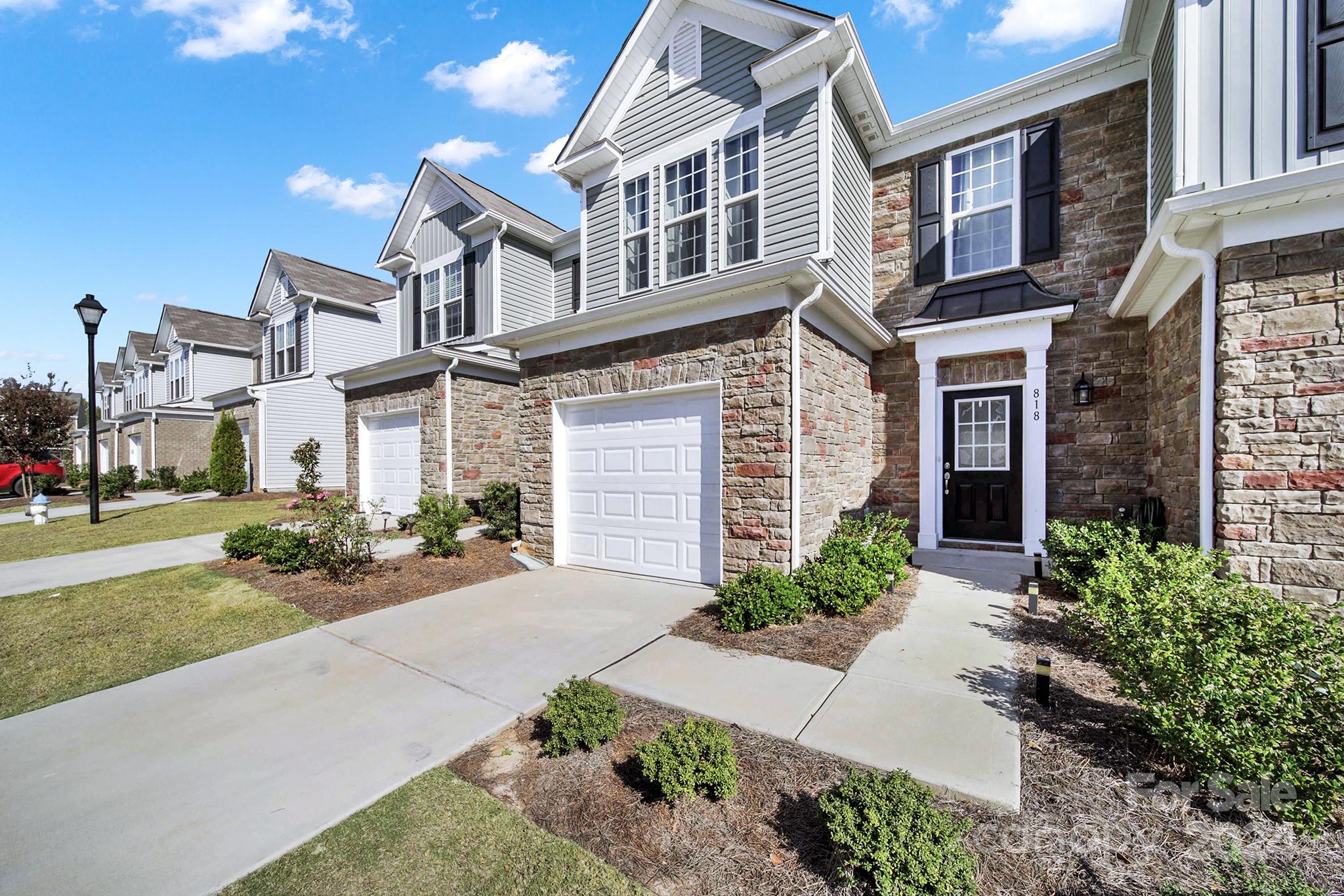 818 Canoe Song Road Fort Mill, SC 29708 - Photo 31 of 36 a front view of a house with yard and green space