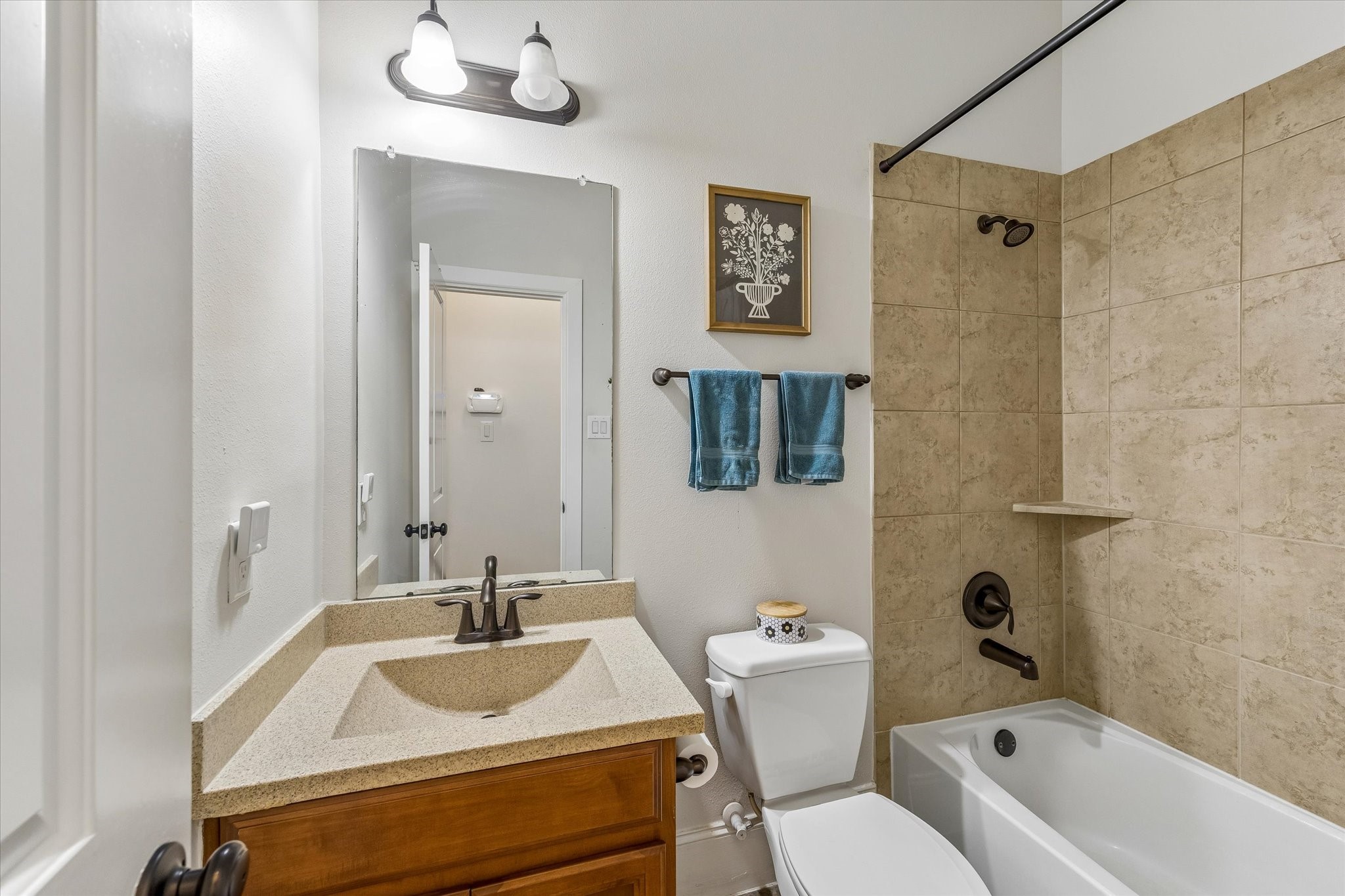 31306 Brighton Brook Lane Spring, TX 77386 - Photo 28 of 34 Secondary full bathroom featuring granite-style countertops, upgraded fixtures, and tile surround tub/shower.