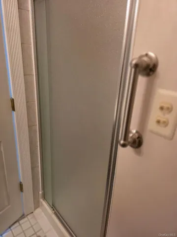 a bathroom with a granite countertop sink toilet and a large mirror