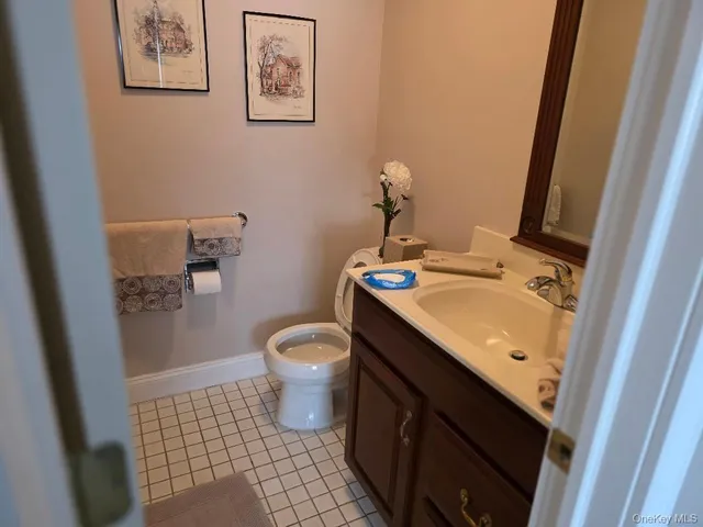 a bathroom with a double vanity sink and mirror