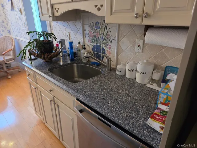 a view of a livingroom with furniture and a lamp