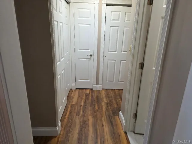 a bedroom with a bed and a mirror