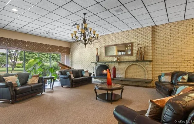 a view of a house with a big yard and potted plants