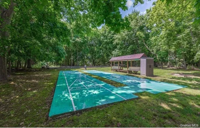 a view of an outdoor space and tennis court