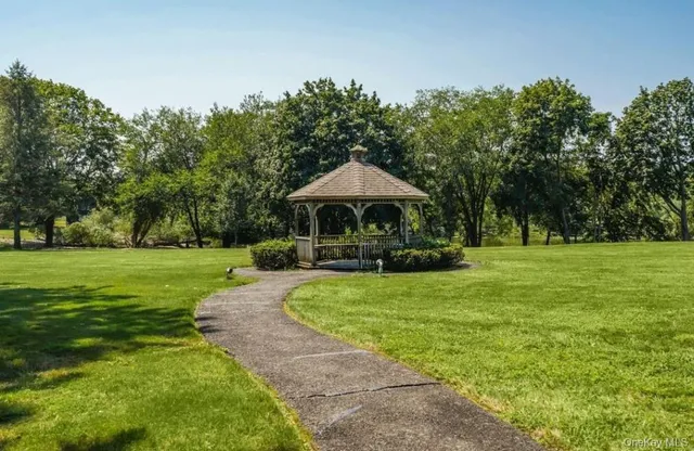 a living room with furniture and entry gate