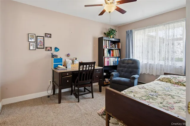 a bathroom with a sink toilet and a mirror