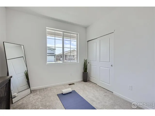 a kitchen with a wooden floor and a fireplace