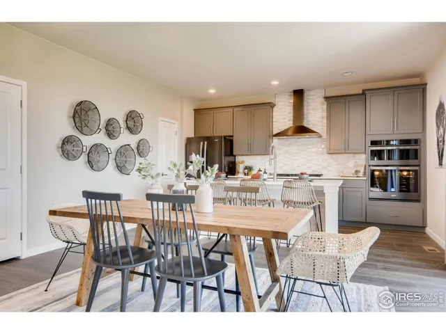 a view of a backyard with sitting area