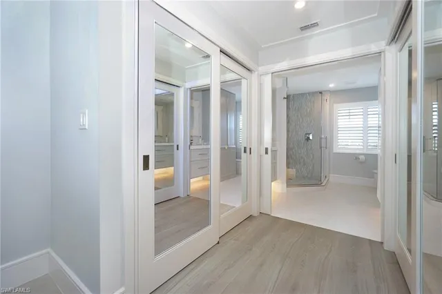 a bathroom with a shower and a sink