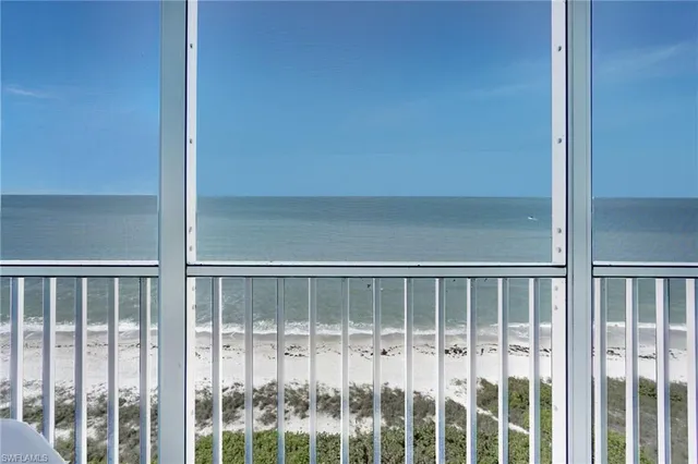 a view of an empty room with glass door