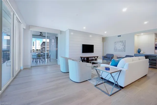 a hallway with a sink and cabinets