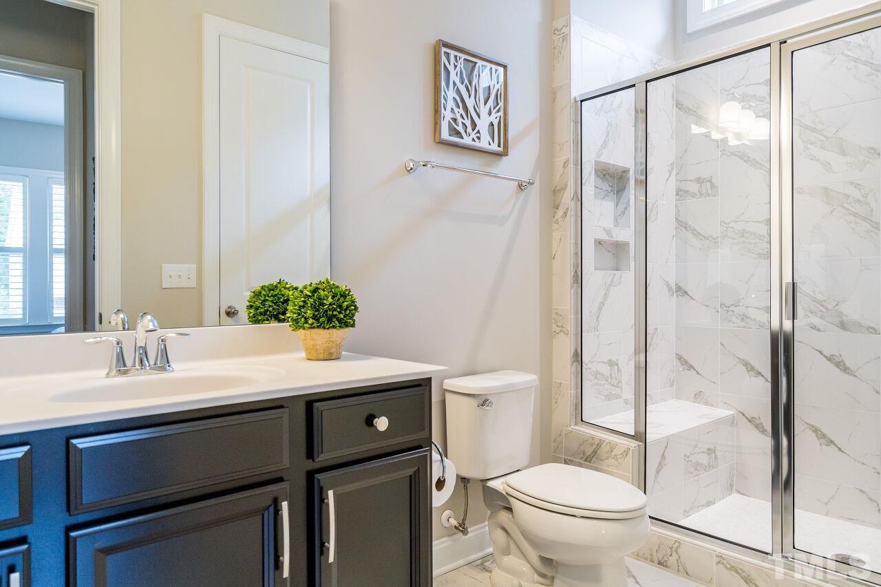 5268 Aleppo Lane Raleigh, NC 27613 - Photo 15 of 30 Full bath on first floor---glamorous tile!