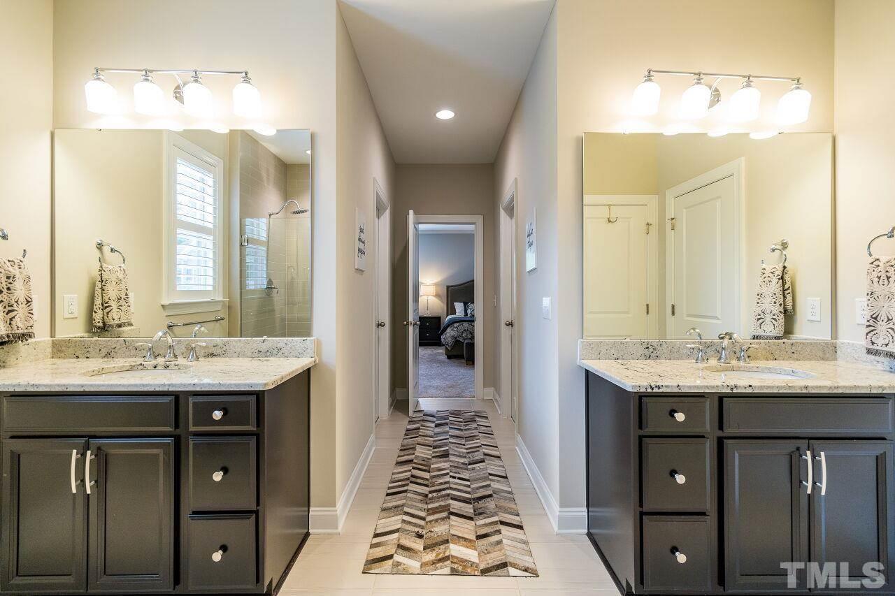 5268 Aleppo Lane Raleigh, NC 27613 - Photo 20 of 30 Spa bath features dual vanities, soaking tub, glass enclosed shower and separate water closet.