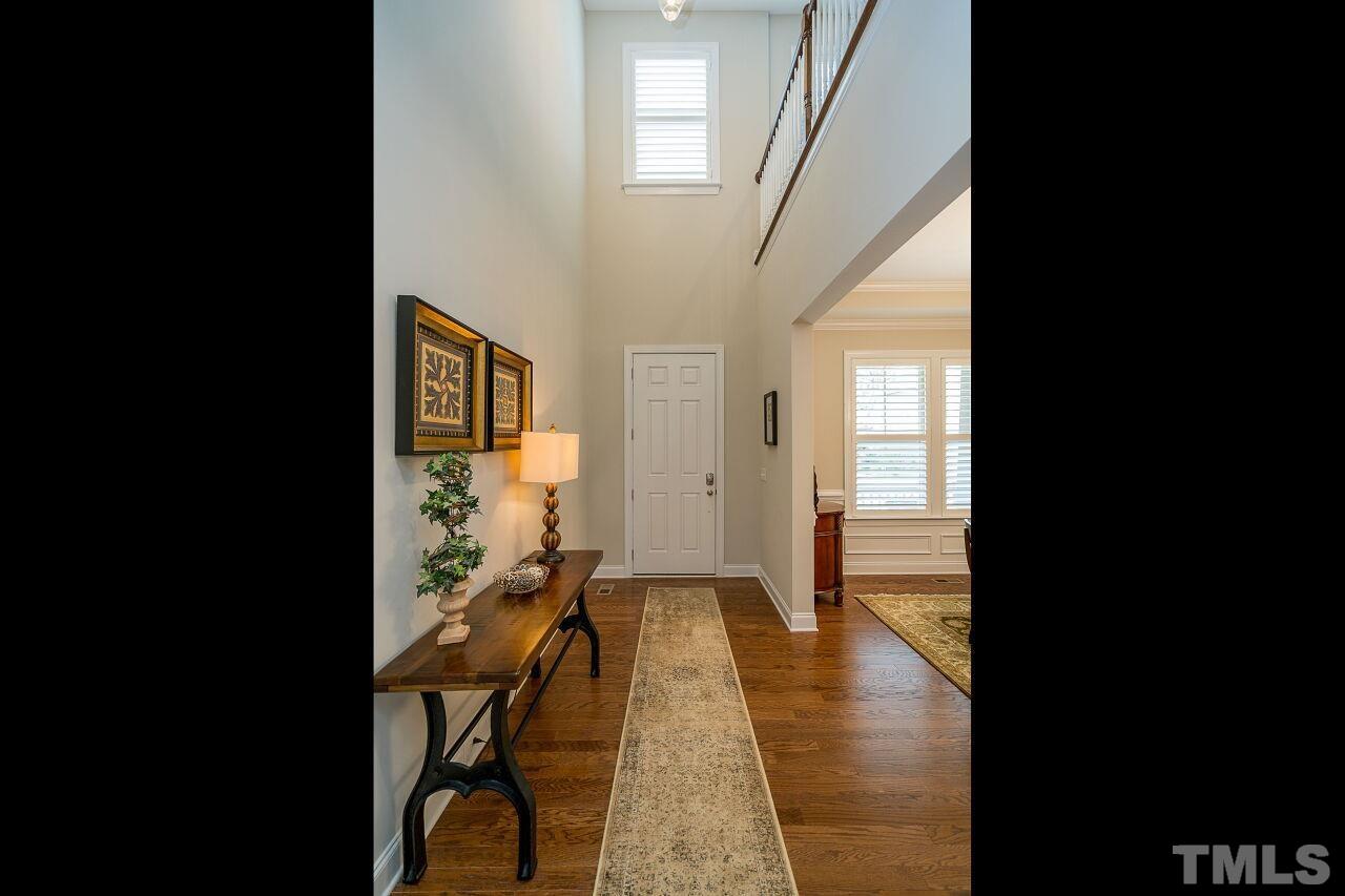 5268 Aleppo Lane Raleigh, NC 27613 - Photo 3 of 30 Breathtaking foyer greets you with hardwoods, open staircase & updated lighting!