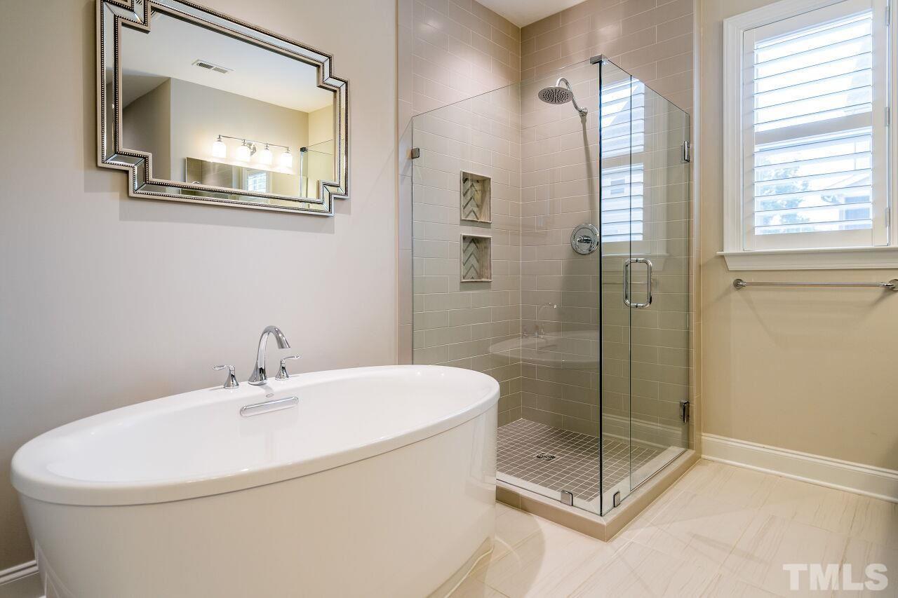 5268 Aleppo Lane Raleigh, NC 27613 - Photo 21 of 30 Spa bath features dual vanities, soaking tub, glass enclosed shower and separate water closet.