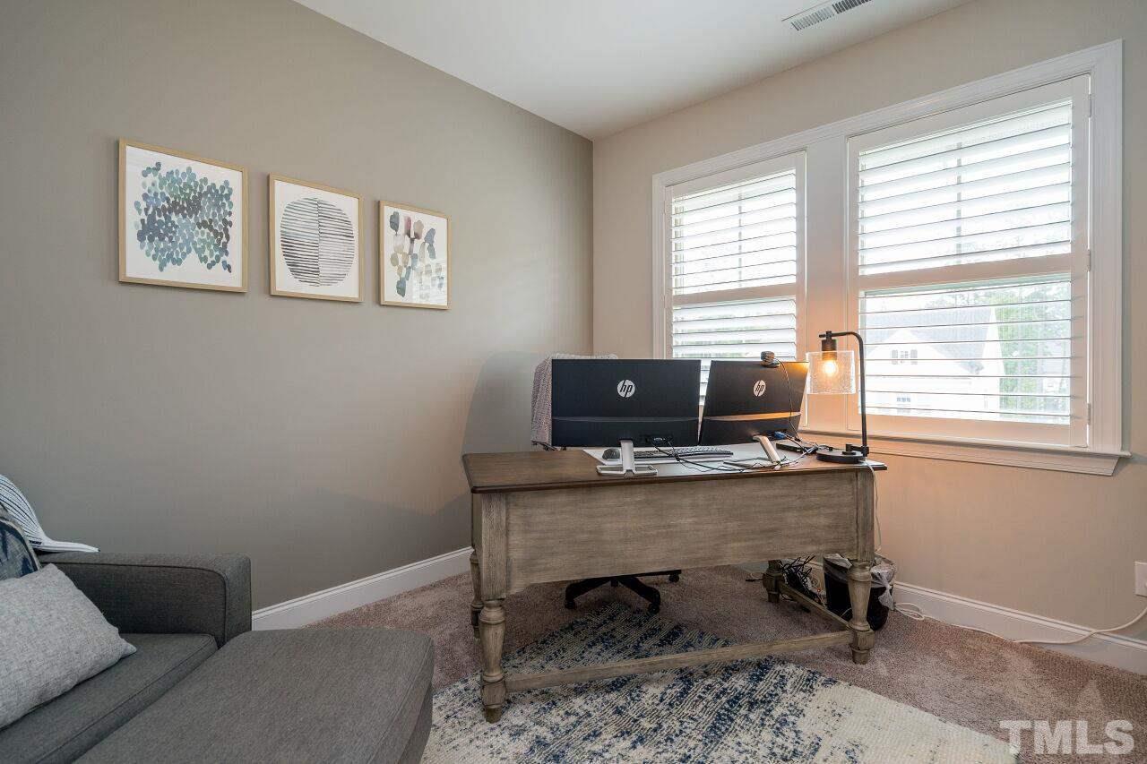 5268 Aleppo Lane Raleigh, NC 27613 - Photo 22 of 30 Second floor bedroom set up as a home office with beautiful light and shutters!